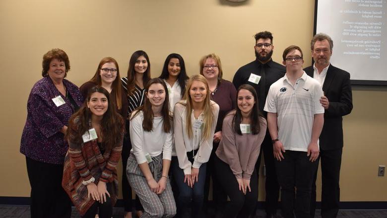 group of students, guest speaker and faculty